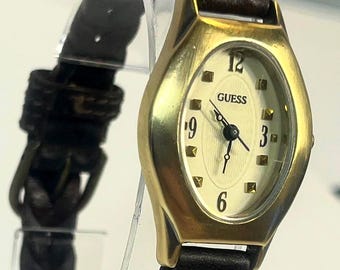 Guess Vintage Watch Gold Tone Case White Textured Dial Arabic Numerals Brown Braided Leather Strap Quartz Movement Retro Style