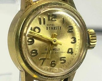 Royal Dynasty Vintage Watch Gold Tone Case Expansion Band 17 Jewels Mechanical Manual Wind Unbreakable Mainspring Mid Century Small Crack