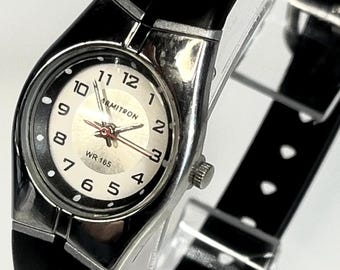 Armitron Vintage Ladies Sport Watch Silver Tone Case Round White Dial Black Arabic Numerals Red Second Hand Black Resin Band Water Resistant
