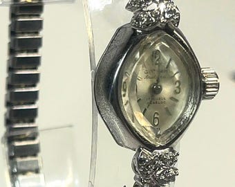 Vintage & Rare Gotham Aristocrat 17 jewel ladies' cocktail wristwatch featuring a silver-tone case and decorative diamond accents.
