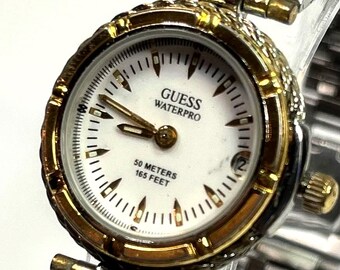 Guess Waterpro women's 26mm two-tone (gold and silver) design with a white analog dial and date. New Battery
