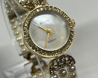 Vintage Roje Caroline style faux pearl cocktail watch with a new battery.