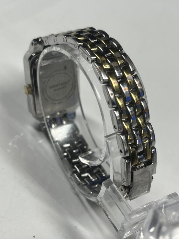 A rectangular Armitron two-tone watch with a whit… - image 9