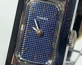 Rare Vintage TIMEX 17 Jewel cocktail watch. Wind up. Made in France. Silver tone Case. Original leather strap. Serviced and running well.