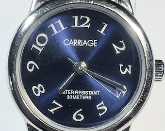 Carriage by Timex blue dial white strap 1990s vintage quartz 30m water resistant with a new battery.