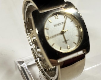 vintage silver-gold tone Rumours TV shaped quartz watch, wide cuff band and white face and new battery
