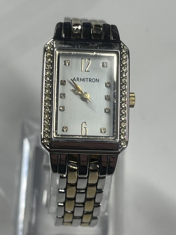 A rectangular Armitron two-tone watch with a whit… - image 5