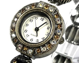 vintage Avon women's quartz watch with a stretch band and multi-colored rhinestone accents. New battery