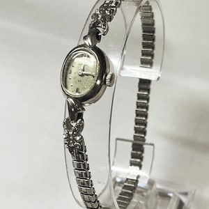 Vintage Hamilton 10K RGP bezel ladies Bulova cocktail watch. Gold plated caps on Speidel bracelet. 17 jewel 780 movement Winds and runs.