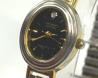 Vintage Nelsonic 17mm Diamond Quartz Black Dial with New Battery.