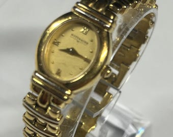 vintage Wittnauer women's gold-tone 1990's oval case, gold dial, Roman numeral hour markers, integrated gold-tone bracelet. New Battery