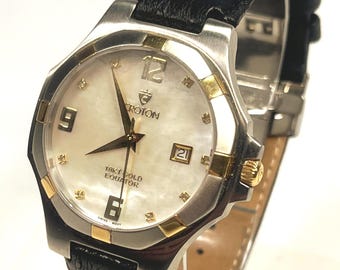 Rare Croton 18kt Gold Equator, Mother-of-pearl dial, diamond markers, date display. Bezel, crown, & Accents - 18k gold. New Battery, Ostrich