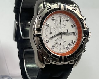 Croton Chronomaster ,white dial, orange accents, black silicone strap. chronograph and tachymeter scale New Battery.