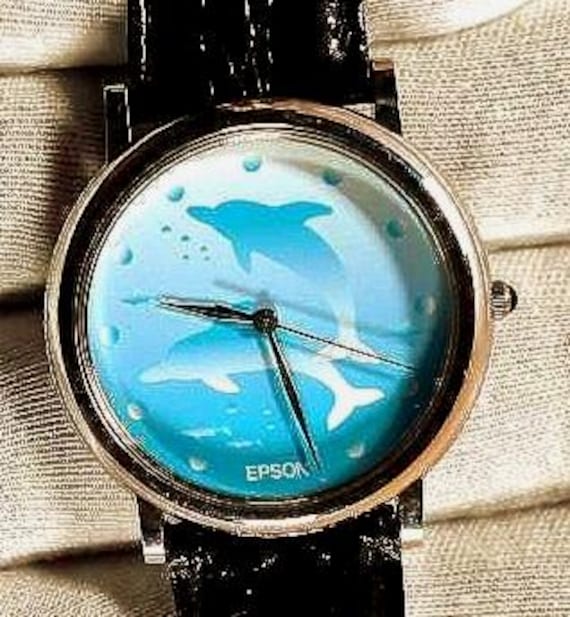 Epson 32mm Extremely rare Vintage quartz wristwatch on a black leather strap unique blue face Epson design knurled bezel edge. New battery