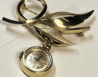 vintage Nivada Rolled gold plated brooch, 17 jewel watch 1960s Swiss made mechanical movement, jewelry item leaf design pin. Running