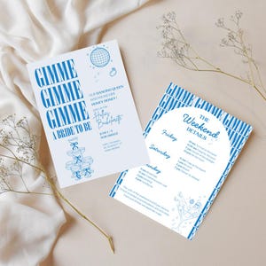 May include: Two white rectangular bachelorette party invitation cards with blue text and graphics. One card features a disco ball, a ring, and a champagne tower. The other card has an arched section detailing weekend events and a martini glass illustration.