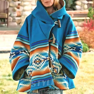 May include: A blue hooded coat with a Southwestern-inspired pattern in shades of orange, blue, and white. The coat features a toggle closure and the text "STYLE CENTRAL" at the bottom.