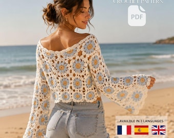 May include: A crochet crop top featuring a pattern of white, light blue, and yellow daisy granny squares with long bell sleeves. The text BOHO DAISY GRANNY SQUARE CROP TOP CROCHET PATTERN and PDF are visible. A small graphic shows French, Spanish, and British flags.