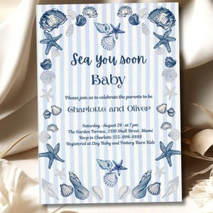 May include: Baby shower invitation with a nautical theme. The invitation features blue and white stripes, seashells, and starfish. Text includes "Sea you soon Baby", names, date, time, and location.