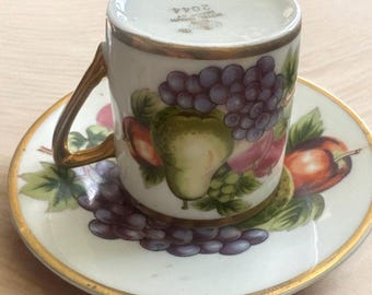 Demitasse cup and saucer set is part of the Royal Crown Harvest collection, specifically identified as pattern 2044.