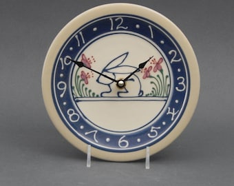 7"  Small Stoneware Clock Blue Bunny with Flowers (no green running pattern) - Stoneware Pottery