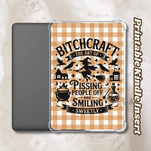 May include: A Kindle insert with a clear case featuring a tan and white gingham pattern. The insert has a black graphic with the text "Bitchcraft: The Art of Pissing People Off and Smiling Sweetly" and witch-themed illustrations.