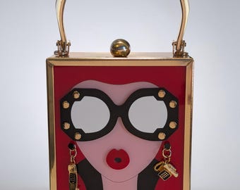 Pop Art Face Clutch Bag – Red Acrylic Novelty Handbag with Gold Frame & Phone Charms – Statement Crossbody Purse - The Hotline