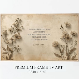 May include: A framed art print featuring a sepia-toned floral design with the text "I AM THE RESURRECTION AND THE LIFE. WHOEVER BELIEVES IN ME, THOUGH HE DIE, YET SHALL HE LIVE" JOHN 11:25. The words "PREMIUM FRAME TV ART" and dimensions are also included.