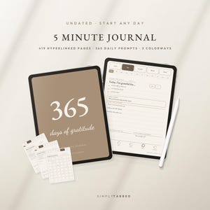 May include: A digital 5 Minute Journal with 419 hyperlinked pages and 365 daily prompts. The display shows a brown cover with the text 365 days of gratitude and an open page with gratitude prompts. A white stylus is positioned next to the tablet.