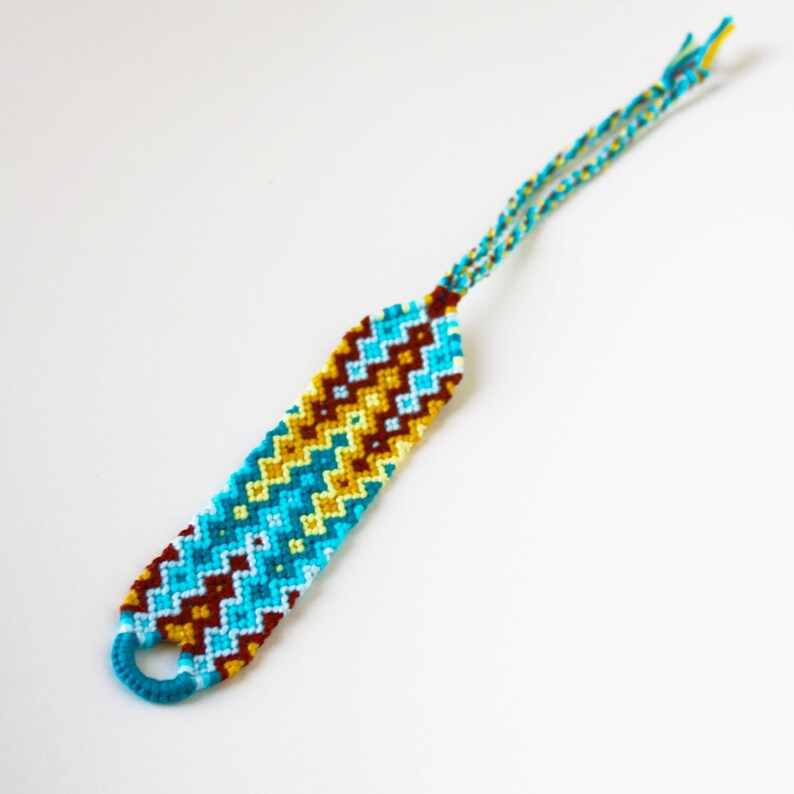 Friendship bracelet macram\u00e9 Boho statement cuff geometric double waterfall pattern design blue brightly colored ripple zigzag beach