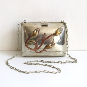 Bolso de mano de alpaca mexicana con mezcla de metales plateados y calas