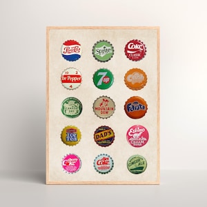 May include: A framed collage of 18 vintage soda bottle caps, featuring brands like Pepsi, Sprite, Coke, Dr Pepper, 7 Up, Crush, Canada Dry, Mountain Dew, Fanta, Ice Tea, Dad's, Eskimo Cream Soda, Cherry Coke, Diet Coke, and Ginger Ale.