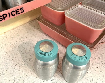 Set of two vintage turquoise Kromex spice jars: paprika and nutmeg
