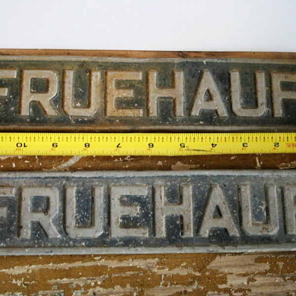 FRUEHAUF sign with rust and character