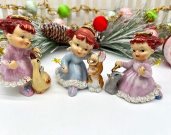 Vintage Ardalt angels placing halos on little animals