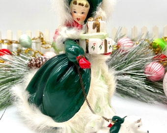 Napco shopper girl figurine with rabbit fur trim and poodle on original chain
