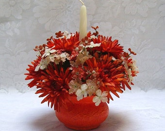 Orange Candle Holder with an Artificial Flower Ring for Table Centerpiece