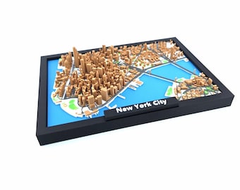 May include: A 3D model of New York City, featuring a detailed representation of the city's buildings and streets. The model is set against a blue background, framed in a black border, and includes a label that reads "New York City".