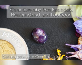 Oval Zoned Canadian Corundum-Ruby Cabochon