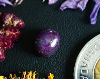 Oval Zoned Canadian Corundum-Ruby Cabochon