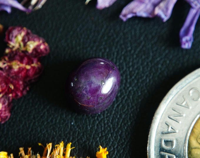 Oval Zoned Corundum-Ruby Cabochon