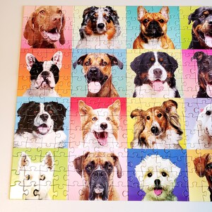 May include: A colorful jigsaw puzzle featuring a grid of dog portraits. Each dog is set against a different vibrant background color, including pink, green, and blue. The dogs are of various breeds, with happy expressions.