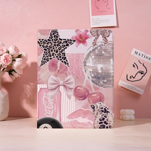 May include: A pink and white collage featuring a leopard print star, bow, disco ball, cherries, and a Coca-Cola can. The design includes a pink flower, lips, and a leopard print pattern. The collage has a retro, girly aesthetic.