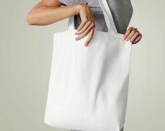 May include: A white tote bag with long handles. The bag is made of a canvas material and is empty.