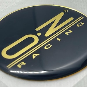 OZ Racing Logo 3D Domed Gel Sticker | 60mm Round Gold Black Decal | High-Quality Wheel & Car Emblem