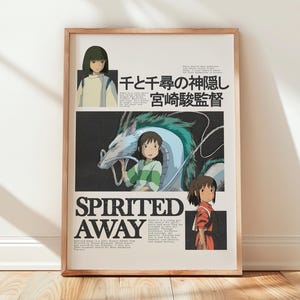 May include: Framed poster featuring artwork from the animated film "Spirited Away." The poster has a beige background with Japanese text and illustrations of characters and a dragon. The title "Spirited Away" is printed in large, bold letters.