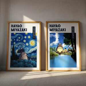 May include: Two framed art prints featuring Hayao Miyazaki artwork. One print depicts a scene inspired by Van Gogh's Starry Night with Totoro characters. The other shows Totoro and friends by a river. Both have text.