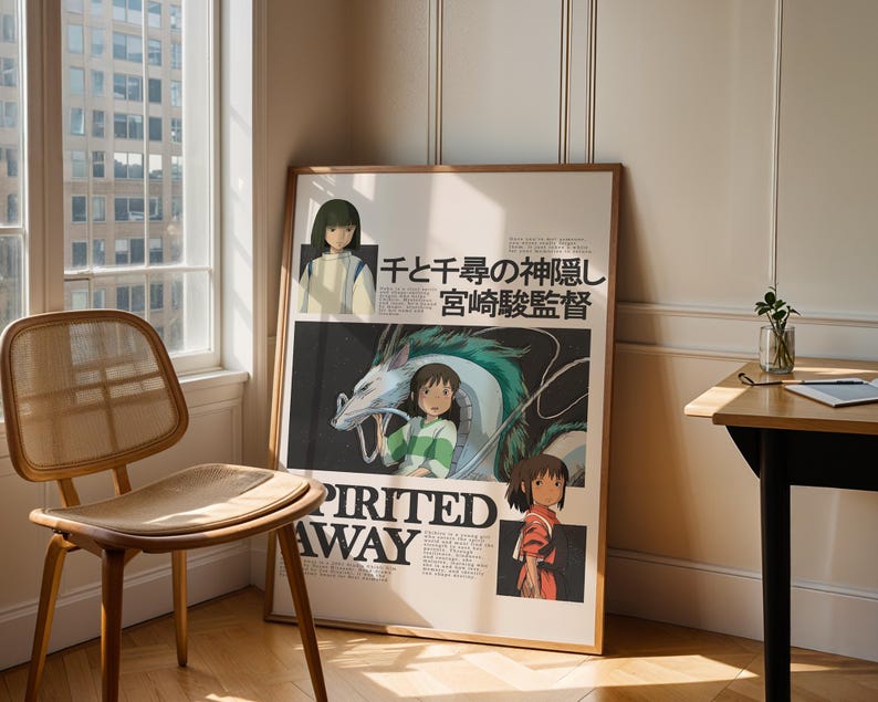 May include: A framed poster of the animated film "Spirited Away" with a light wood frame. The poster is leaning against a wall. The artwork features characters and Japanese text. The poster is displayed near a window and a wooden chair, creating a minimalist aesthetic.