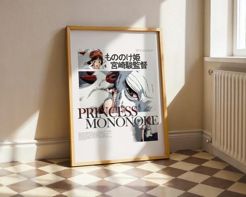 May include: A framed poster featuring the title "Princess Mononoke" in large, bold letters. The artwork includes illustrations of characters and Japanese text. The poster is in a wooden frame and leans against a wall.