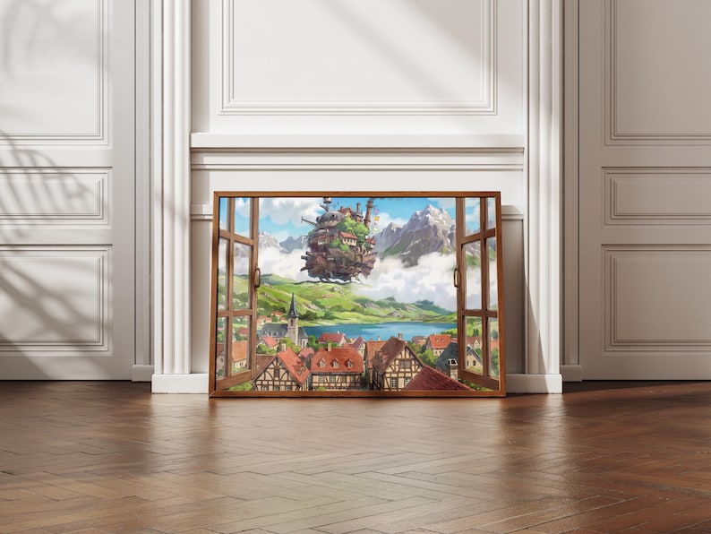 May include: A framed print showing a fantastical landscape seen through an open window. The artwork features a floating castle above a village with red roofs, a lake, and mountains. The frame is brown, set against a white wall and a wooden floor.